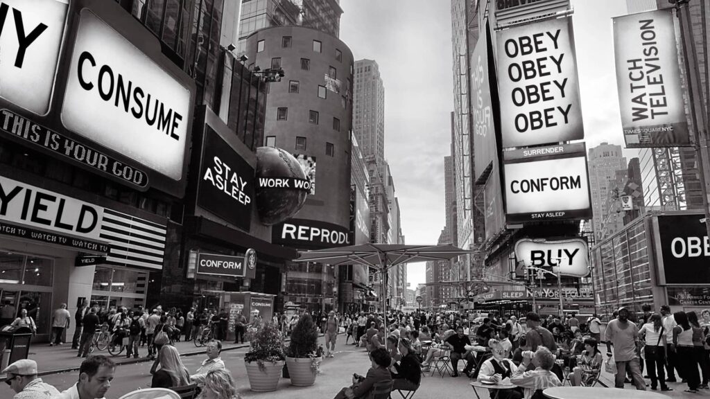Still from the film They Live showing billboards with text like "Obey", "Consume", "Watch Television", "buy", and the like - the subliminal messaging behind the adverts